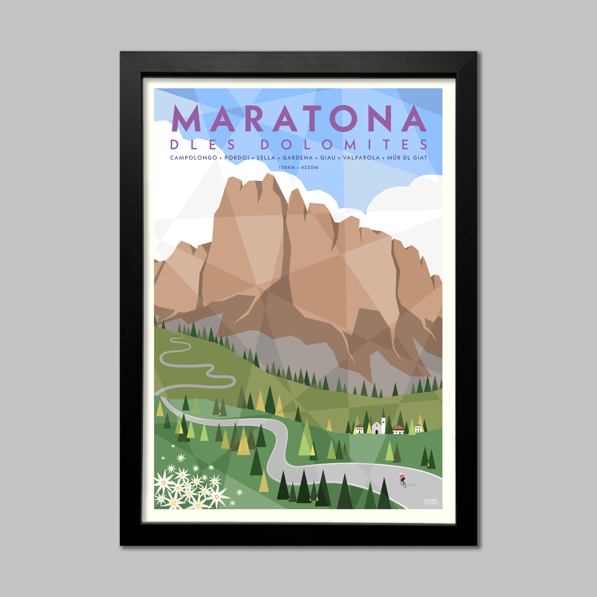 Framed poster of Maratona Dles Dolomites with mountain and road design and a cyclist.