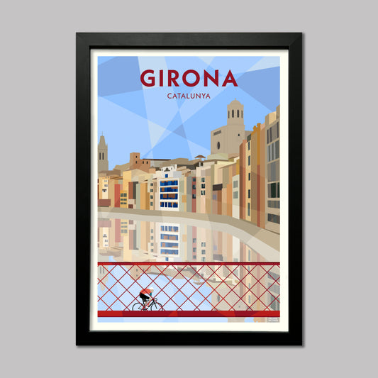 Framed poster of Girona, Catalunya with cityscape and cyclist on a bridge.