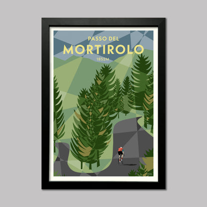 Print of a cyclist through the trees on the Mortirolo climb in the Italian Alps. Presented in a black frame.