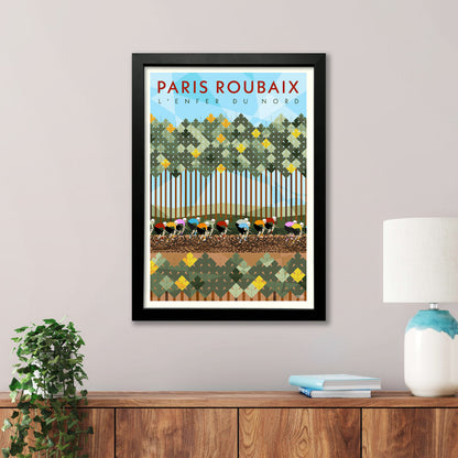 Paris Roubaix Monuments Framed Cycling Print depicting riders cycling on the pavé section of the Arenberg Forest. 
