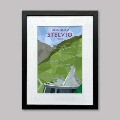 Print of a cyclist on the climb up to the Stelvio pass. The white stone walled hairpins are visible winding up the road ahead. Presented in a black frame with a white mount.